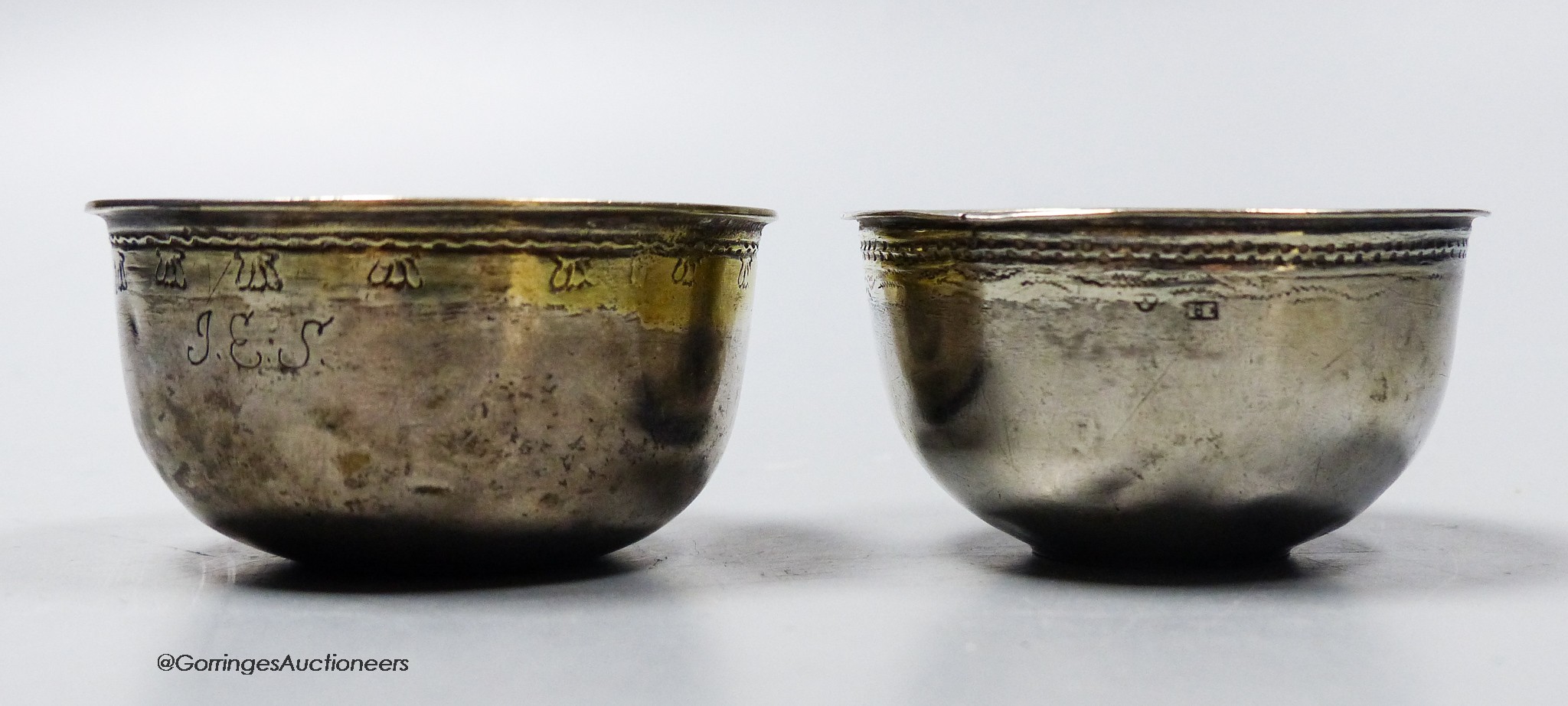 Two 18th century Swedish white metal small bowls, one with inset coin base dated 1708, height 31mm, gross 45 grams.
